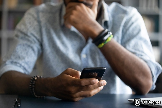 Best Skillshare classes: man scrolling through his phone